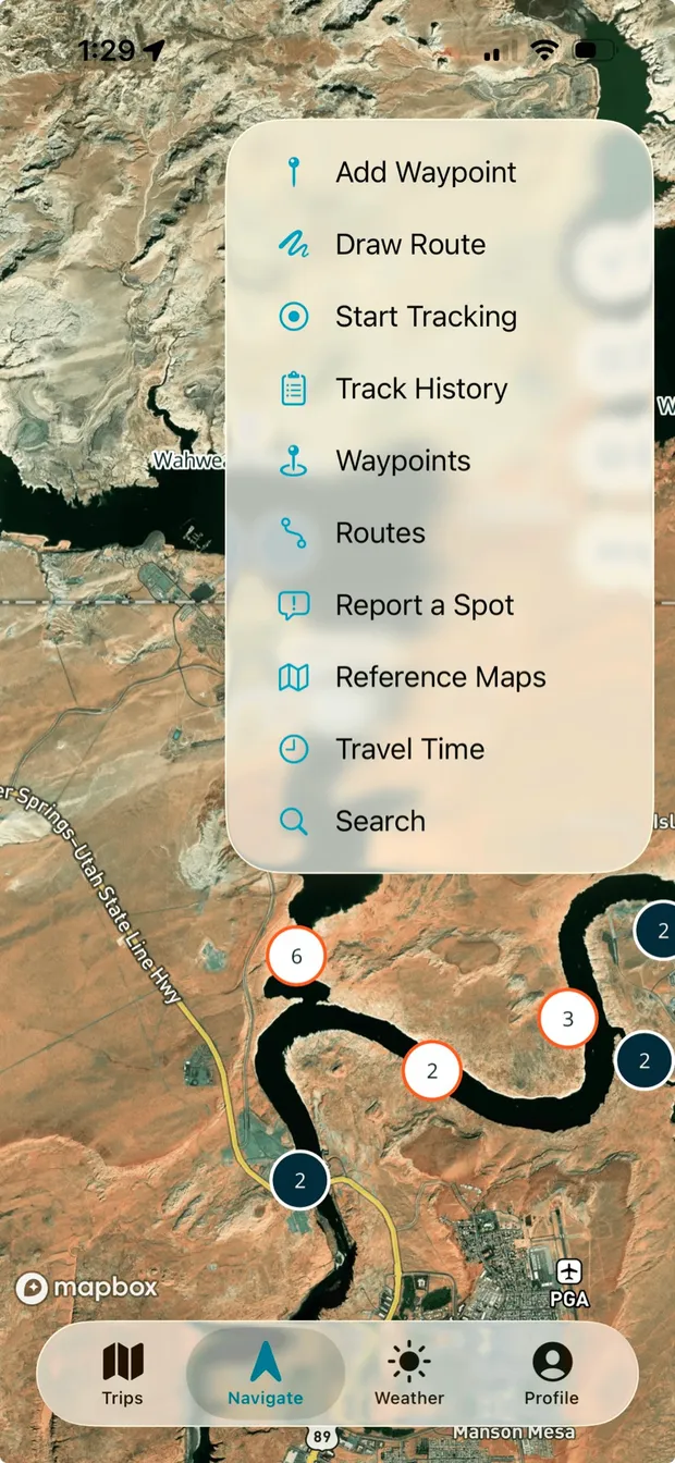 The Lake Powell map quick-action menu with waypoint, route, tracking, search, and travel time tools